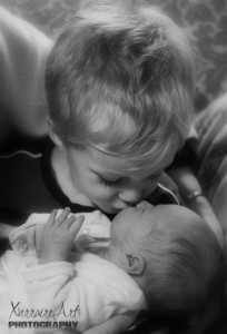 Silas kissing baby sister Rubi